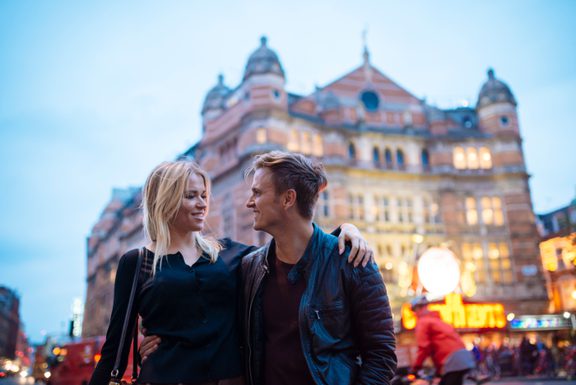 Young couple strolling on city street at night lo 2024 10 18 23 35 31 utc