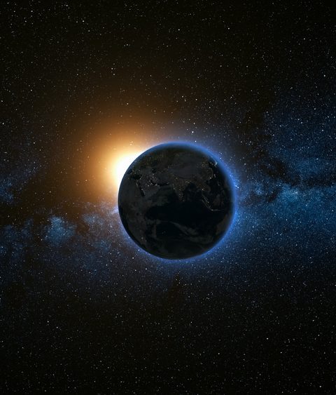 Space view on Planet Earth and Sun Star rotating on its axis in black Universe. Milky Way in the background. Seamless loop with day and night city lights change. Elements of image furnished by NASA